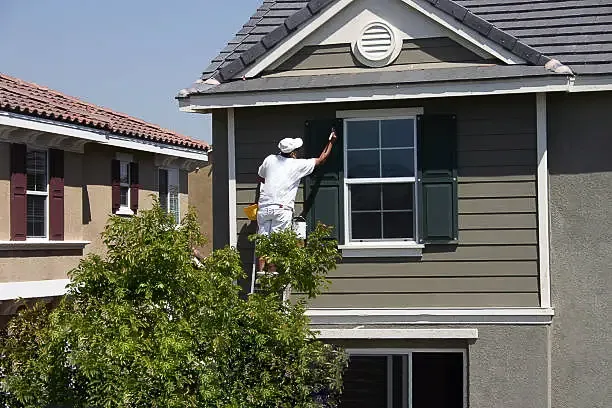 Painter at work on a home exterior